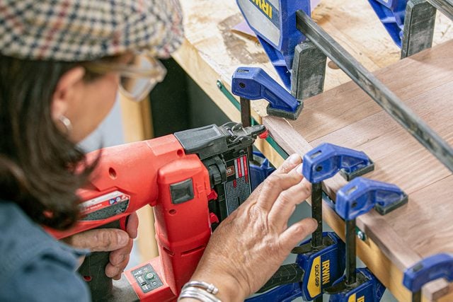 wooden trim pieces for panels being nailed